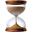 Hourglass timer with sand partially flowing from upper to lower chamber.