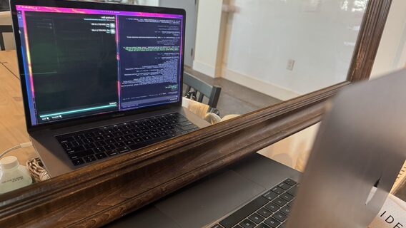 A developer made an old MacBook look at itself in a mirror so that AI could check for changes in an AMD driver. How does it work?